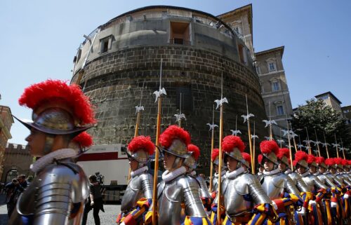 Members of the Vatican's elite Swiss Guard march in front of the Institute for the Works of Religion (IOR).