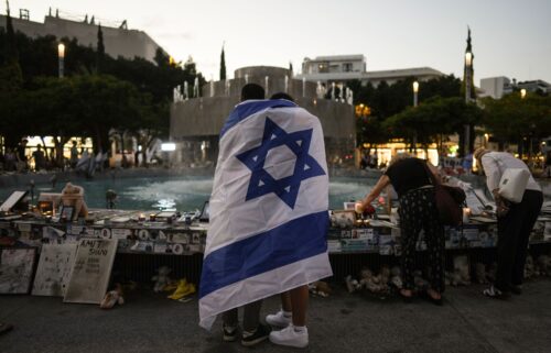 People look at a memorial for victims of the cross-border attack by Hamas militants on the one-year anniversary in Tel Aviv