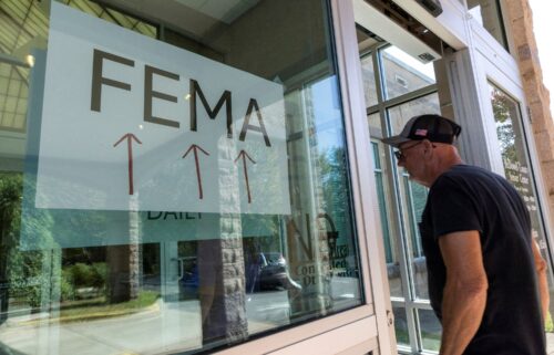 A resident enters a FEMA improvised station to attend claims by local residents affected by floods following the passing of Hurricane Helene