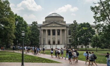 People walk on the campus of the University of North Carolina