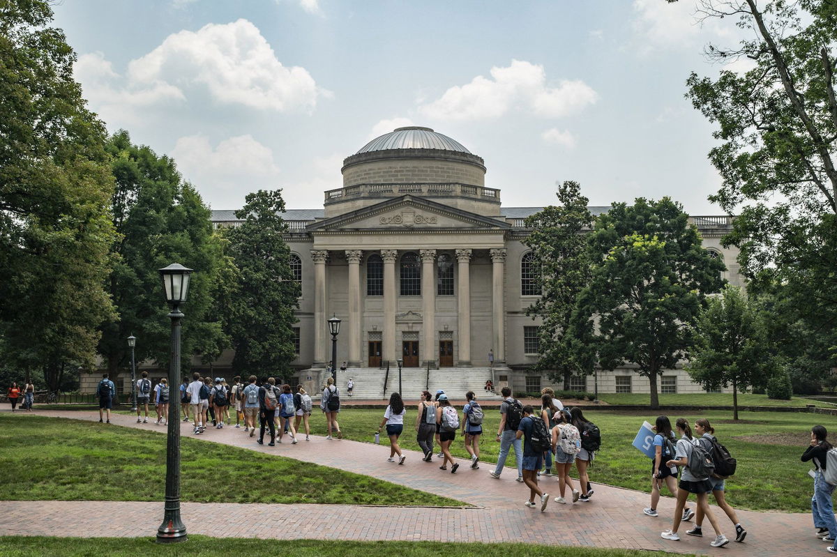 <i>Eros Hoagland/Getty Images via CNN Newsource</i><br/>People walk on the campus of the University of North Carolina