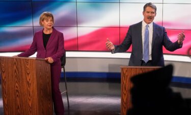 Wisconsin Senate candidates Republican Eric Hovde and Sen. Tammy Baldwin are seen before a televised debate on October 18 in Madison