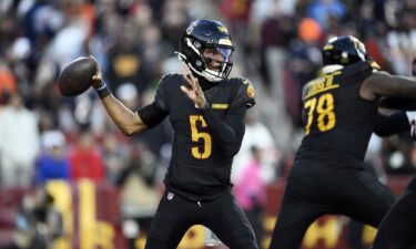 Washington Commanders players celebrate Noah Brown's game-winning Hail Mary touchdown catch to beat the Chicago Bears.