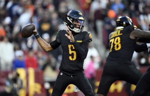 Washington Commanders players celebrate Noah Brown's game-winning Hail Mary touchdown catch to beat the Chicago Bears.