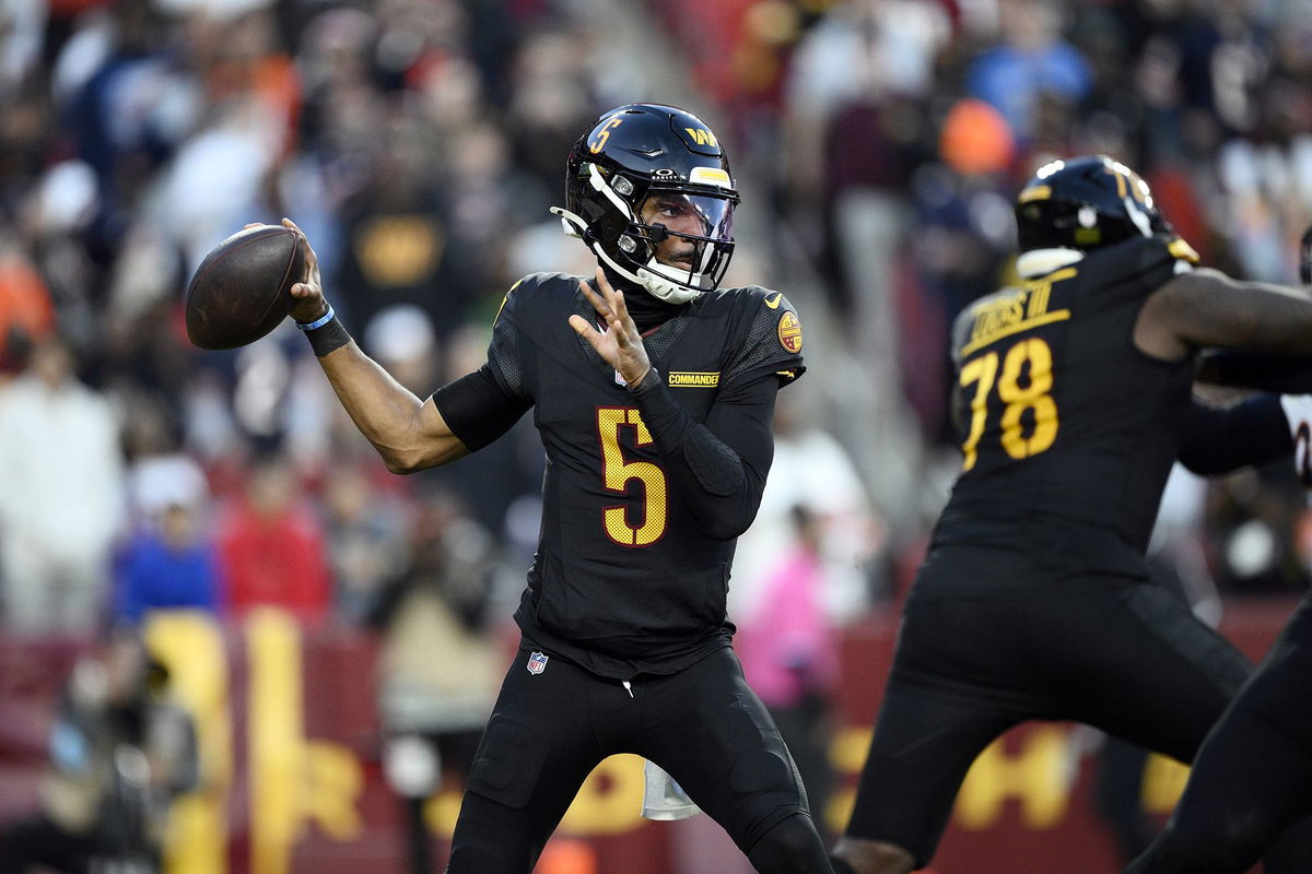 <i>Scott Taetsch/Getty Images via CNN Newsource</i><br/>Washington Commanders players celebrate Noah Brown's game-winning Hail Mary touchdown catch to beat the Chicago Bears.