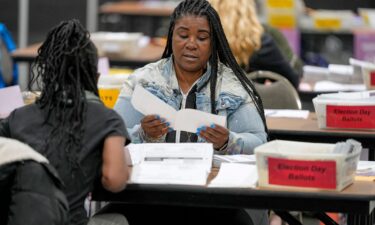 Receipts from early voting are being brought out during election night at the Fulton County Elections Hub and Operation Center in Fairburn