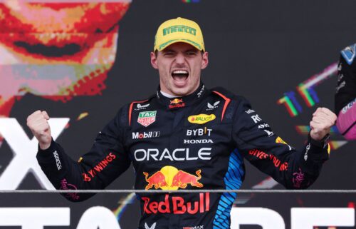 Rain kicks up off the back of Verstappen's car as he competes during the Sao Paulo Grand Prix.