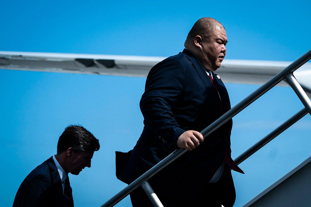 <i>Jabin Botsford/The Washington Post/Getty Images via CNN Newsource</i><br/>Steven Cheung follows former President Donald Trump as they board his plane to fly back to New Jersey on June 13 in Miami.