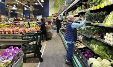 Customers shop at a grocery store in Chicago on October 25. Inflation heated back up again in November.