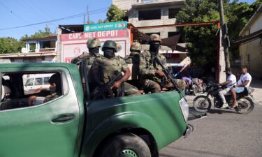 Members of the Haitian Armed Forces patrol as people flee homes following the gang violence over the weekend in Port-au-Prince.