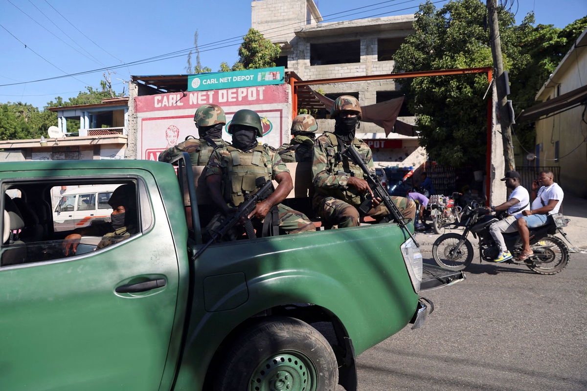 <i>Ralph Tedy Erol/Reuters via CNN Newsource</i><br/>Members of the Haitian Armed Forces patrol as people flee homes following the gang violence over the weekend in Port-au-Prince.