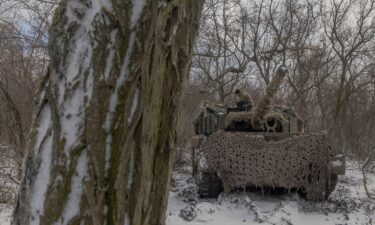 A Ukrainian crew member stands on a Leopard 1A5 tank near Pokrovsk in Ukraine's eastern Donetsk region on December 13.