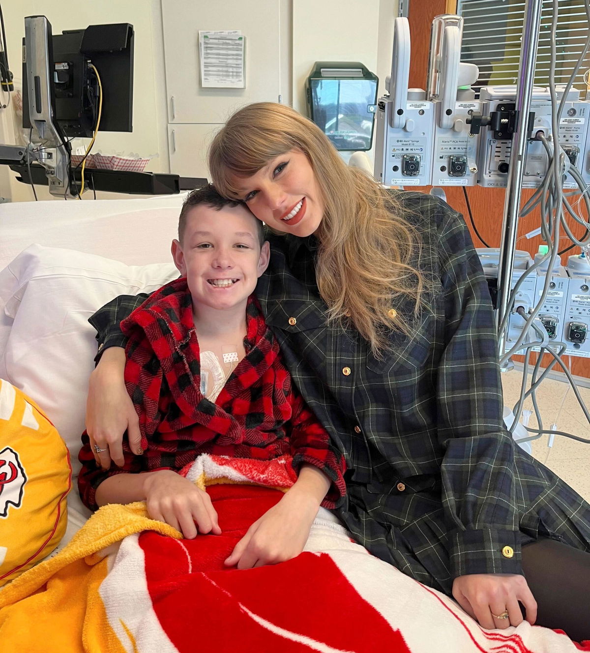 <i>Cassie Thomas via AP via CNN Newsource</i><br/>(From left) Children's Mercy Hospital patient Beckett Thomas and Taylor Swift -- wearing the same outfit she gifted Naya Jade (not pictured) -- at Children's Mercy Hospital in Kansas City on December 12.