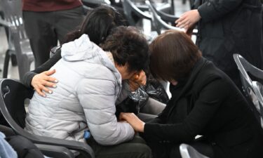 Relatives of passengers who died in the Jeju Air crash mourn their loved ones at Muan International Airport on December 30.