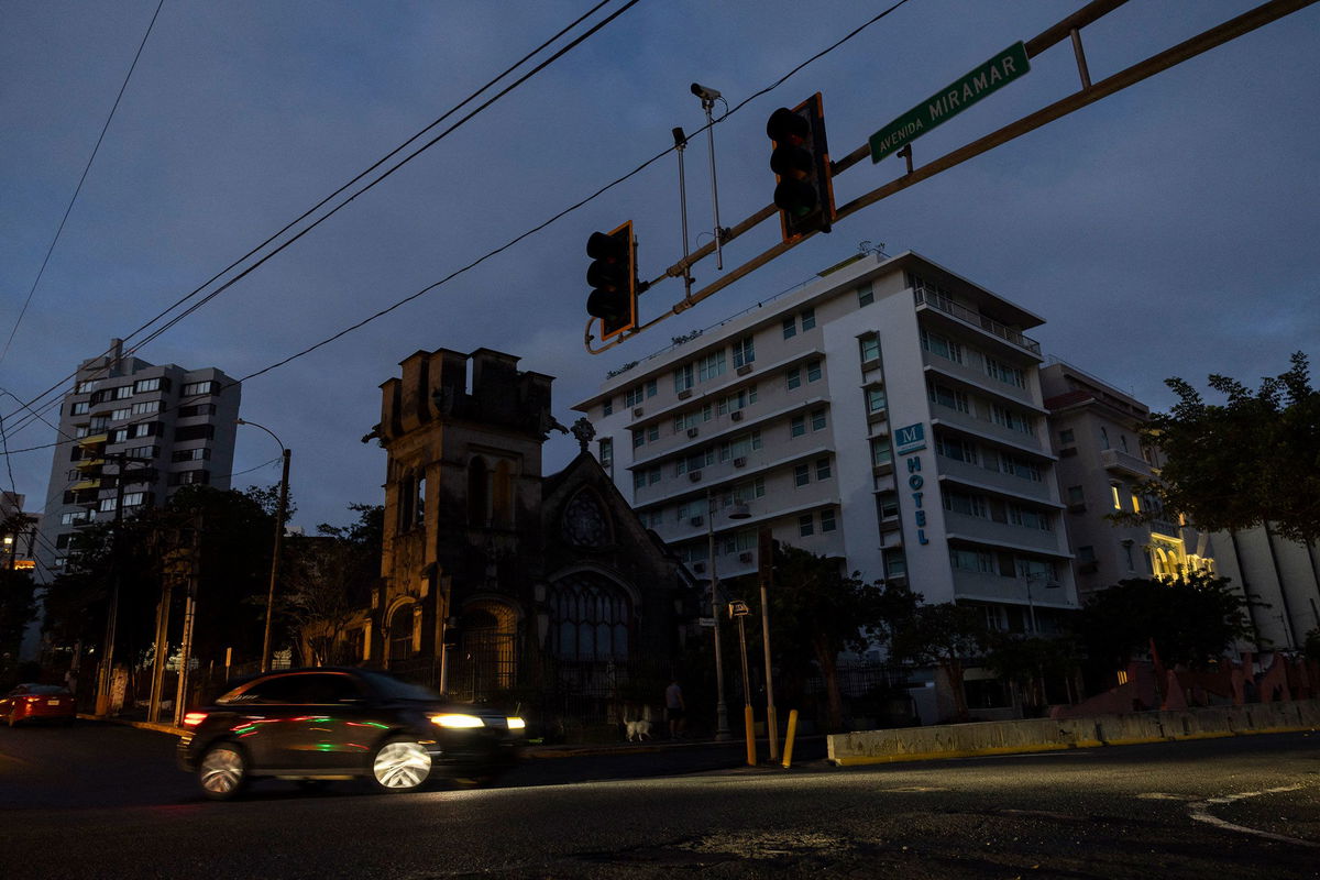 <i>Ricardo Arduengo/AFP/Getty Images via CNN Newsource</i><br/>A car navigates an intersection without working stop lights in San Juan