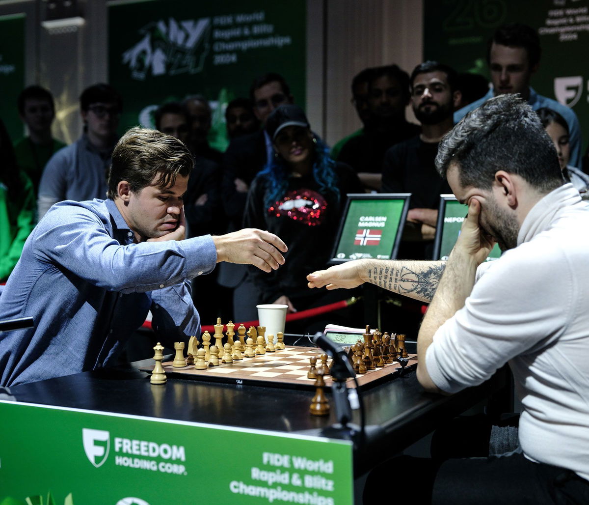 <i>Misha Friedman/Getty Images via CNN Newsource</i><br/>Carlsen and Nepomniachtchi prepare to play in the World Blitz Chess Championship final on Tuesday.