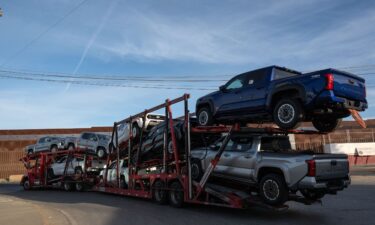 A truck loaded with pickups drives to cross to the US at the Otay commercial crossing port in Tijuana