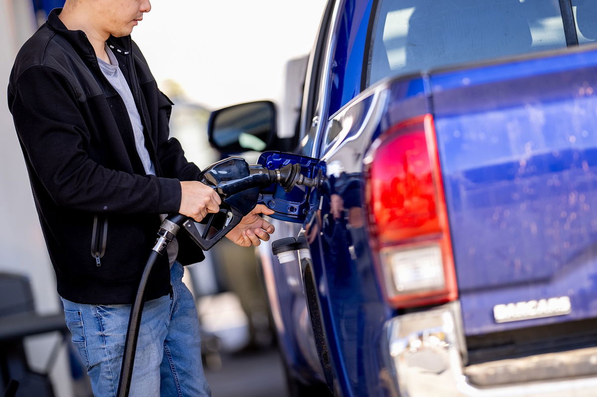 <i>Andrew Harnik/Getty Images via CNN Newsource</i><br/>A man stops to fill up his car at a gas station in Washington