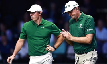 Rory McIlroy (left) of Boston Common Golf reacts during the team's final match of the regular season.
