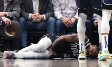 Kyrie Irving lies on the court after suffering an injury against the Sacramento Kings on March 3.