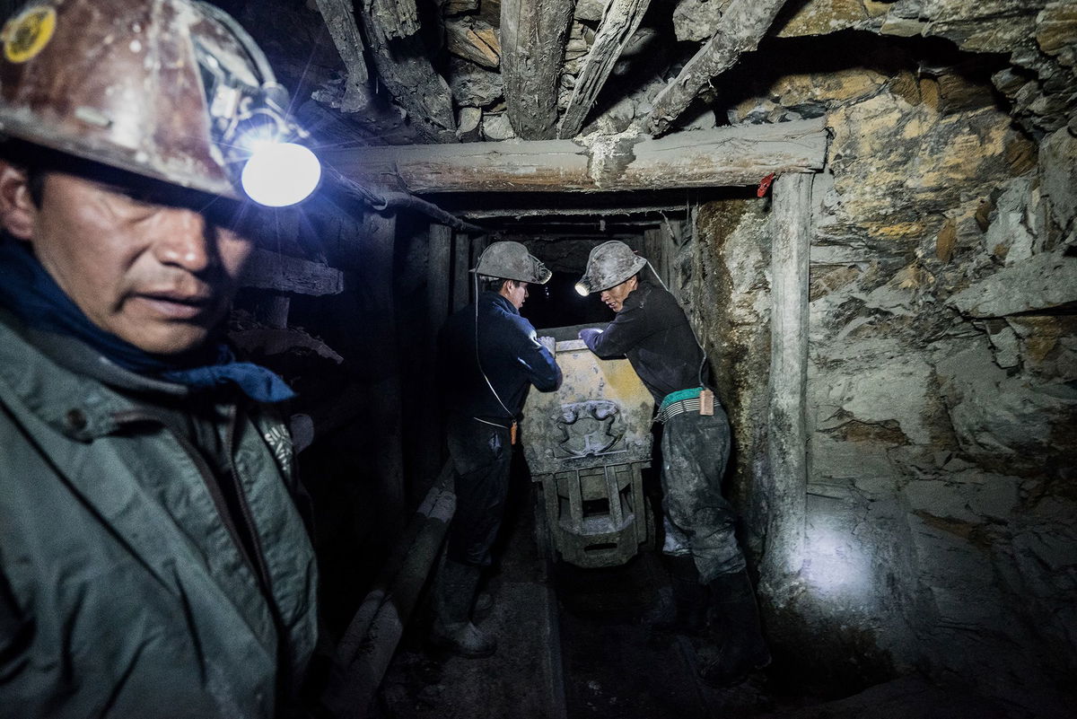 <i>Giles Clarke/Getty Images via CNN Newsource</i><br/>Miners in Bolivian town of Potosí labor in one of the toughest working environments. They spend long days mining and transporting minerals by cart along old rail tracks