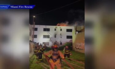 Miami Fire Rescue said the structure fire that sent two firefighters to the hospital appears to have been set intentionally.