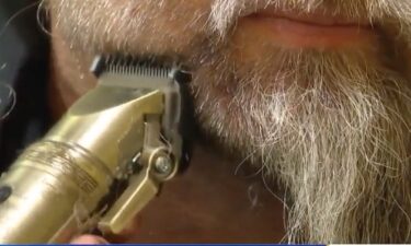 Olley Arelong shaves Principal Aaron Ruff's beard after holding up his end up the deal.