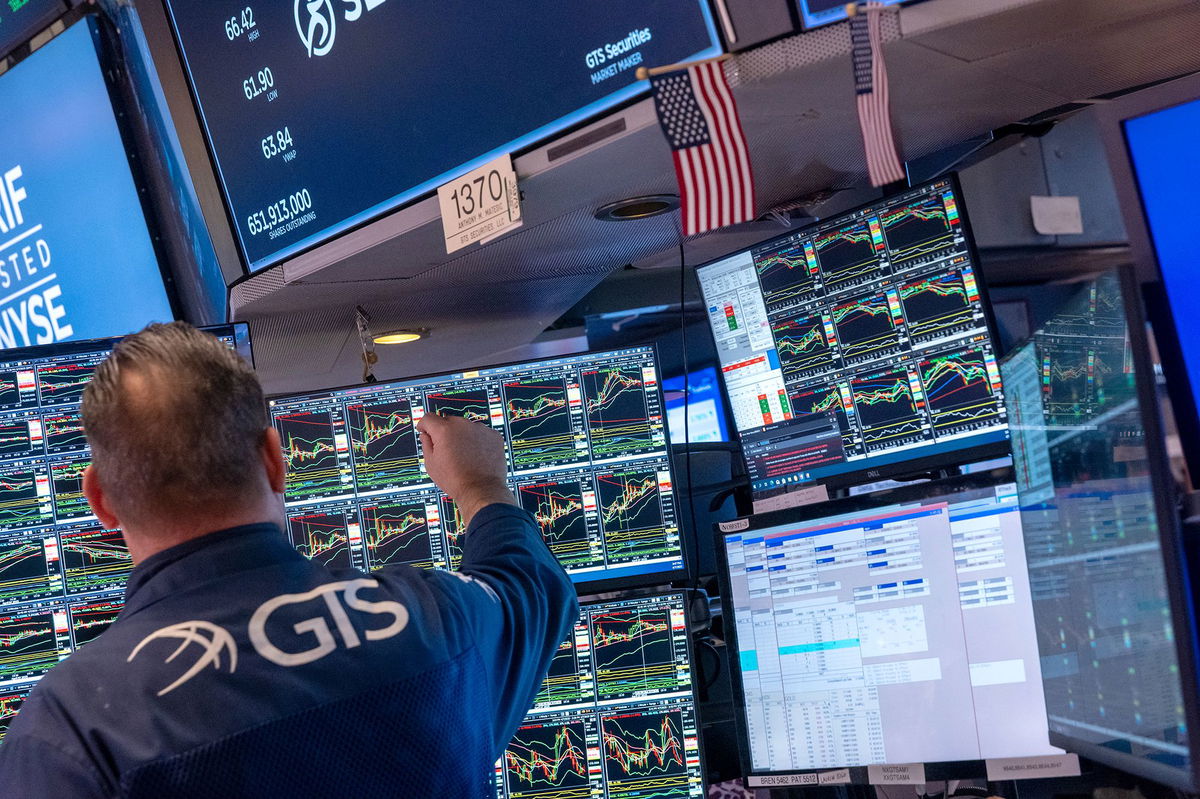 <i>Spencer Platt/Getty Images via CNN Newsource</i><br/>A trader works on the floor of the New York Stock Exchange. After markets plunged over the course of the past three trading sessions