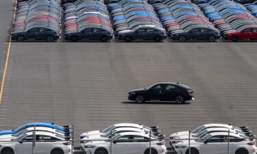 Vehicles awaiting shipment are parked at a port on March 27