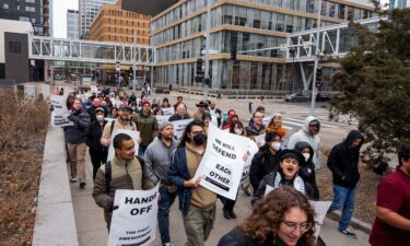 Union members march through downtown Minneapolis on March 29 after University of Minnesota international graduate student Doğukan Günaydin was detained by by ICE agents.