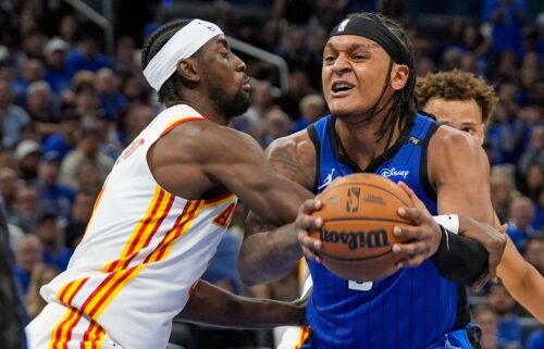 Orlando Magic forward Paolo Banchero is fouled by Atlanta Hawks guard Caris LeVert as he goes up for a shot during Tuesday's NBA play-in tournament game.