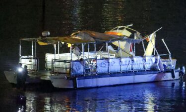 Investigators search the wreckage of a Clearwater Ferry after a boat crashed into the ferry on Sunday