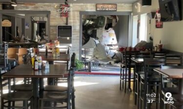 Images of the crash show the truck partially inside the restaurant.