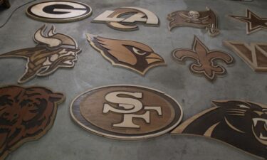 Several of the NFL logos local wood artist Ike Wynter created for the draft in Green Bay.