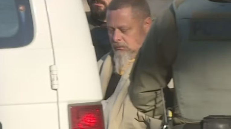 <i>WISH via CNN Newsource</i><br/>File photo - Delphi murders suspect Richard Allen is led to a van.