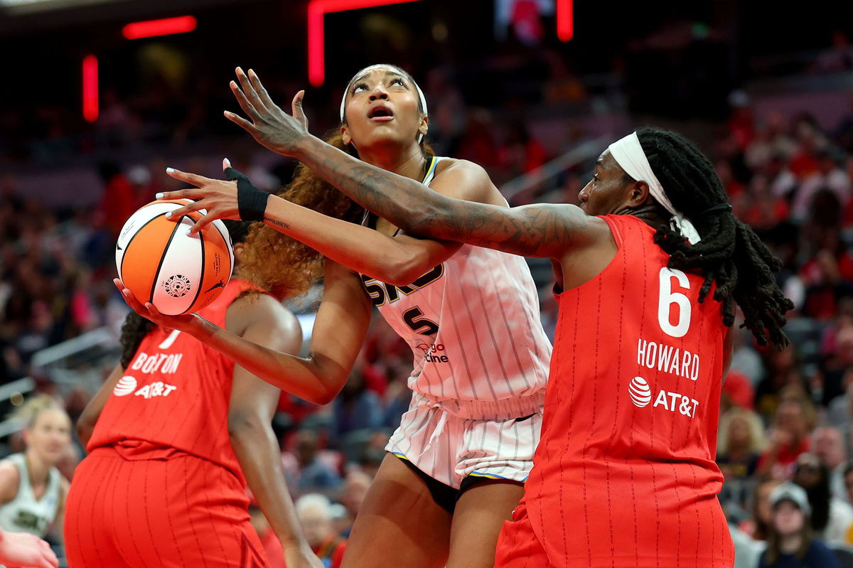 <i>Gregory Shamus/Getty Images via CNN Newsource</i><br/>Angel Reese (center) had 12 points and 17 rebounds in the Chicago Sky's loss to the Indiana Fever on Saturday.