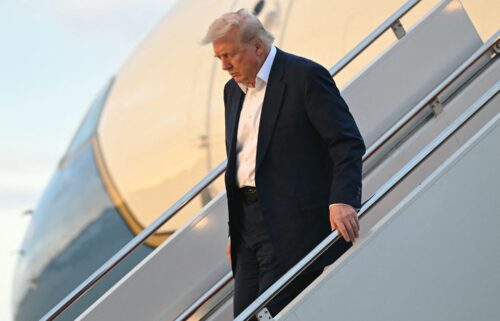 US President Donald Trump disembarks from Air Force One upon arrival at Joint Base Andrews in Maryland