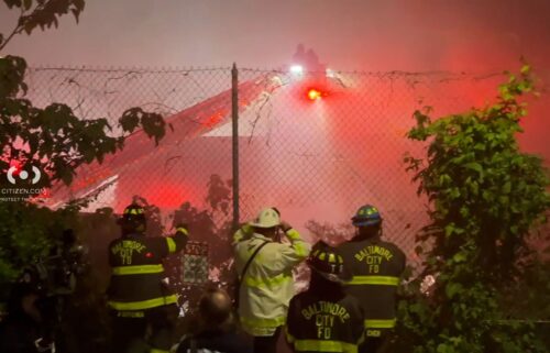 Firefighters battle a blaze at a multi-story mattress warehouse in Baltimore.