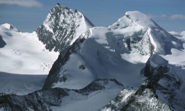 The snow-capped peaks of Rimpfischhorn (left) and Allalinhorn are pictured in the Valais Alps