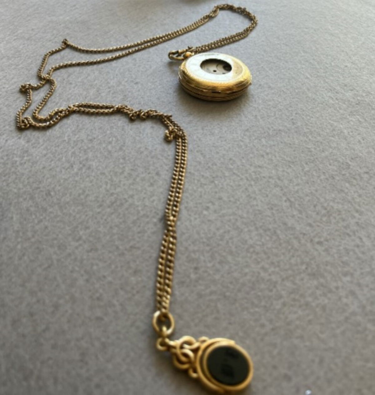 <i>Andy Curtis/WXMI via CNN Newsource</i><br/>Herbert Ingram's initials on his watch fob discovered at the wreckage site of the Lady Elgin.