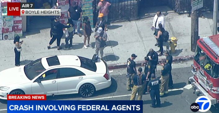 <i>KABC via CNN Newsource</i><br/>Aerial video from AIR7 showed LAPD officers and Los Angeles Fire Department firefighters at the crash site.