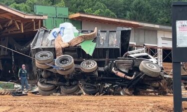 The scene of a fatal crash is pictured near Exit 73 along Interstate 40 in Old Fort. Police say the dump truck lost its brakes and exited the interstate before going airborne and crashing into the building.
