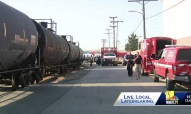 An investigation continues in South Baltimore after a tractor-trailer carrying aluminum sulfate collided with a train.