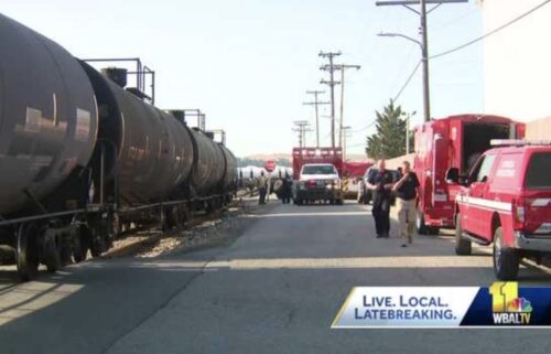 An investigation continues in South Baltimore after a tractor-trailer carrying aluminum sulfate collided with a train.