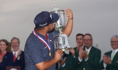 J.J. Spaun putts on the 18th green to win during the final round of the U.S. Open golf tournament.