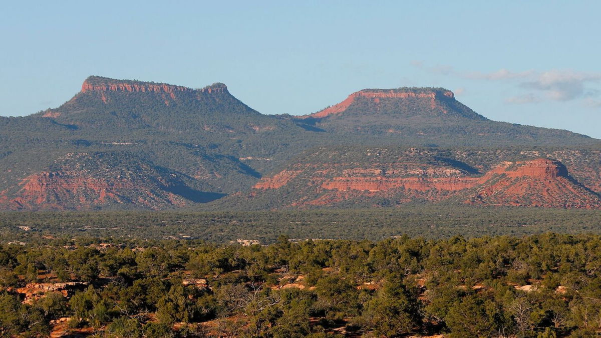 <i>George Frey/Getty Images via CNN Newsource</i><br/>The two bluffs known as the "Bears Ears" stand off in the distance at sunset in the Bears Ears National Monument in May 2017