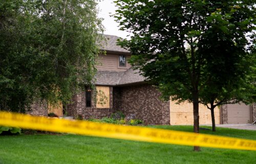 Police are seen outside of Rep. Melissa Hortman's home in Brooklyn Park