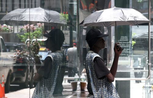 A person tries to stay cool in midtown Manhattan on Monday during extreme heat.