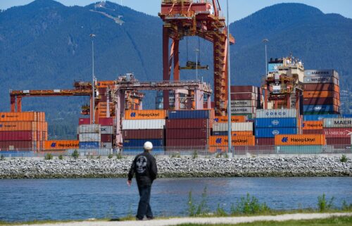 Cargo containers are stacked at the Centerm container terminal in Vancouver