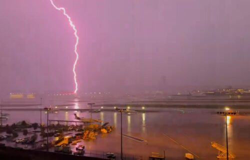 A lightning strike is seen from Atlanta’s Hartsfield-Jackson International Airport on Friday.